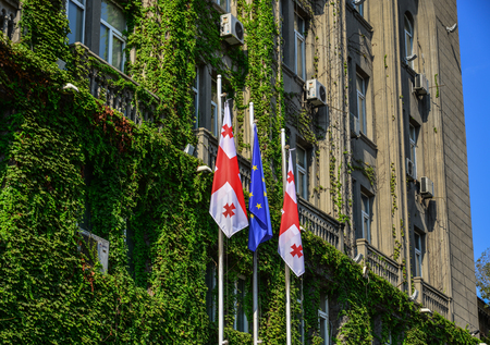 Tbilisi, Georgia - Sep 22, 2018. Government building with flags of Tbilisi, Georgia. Tbilisi is the historic old town, attracting millions of visitors every year.のeditorial素材