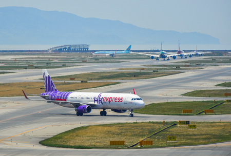 Osaka, Japan - Apr 18, 2019.  B-LEH Hong Kong Express Airbus A321 taxiing on runway of Kansai Airport (KIX) in Osaka, Japan.のeditorial素材