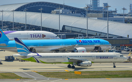 Osaka, Japan - Apr 18, 2019.  Passenger airplanes taxiing on runway of Kansai Airport (KIX) in Osaka, Japan.のeditorial素材