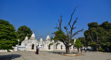 Mandalay, Myanmar - Feb 9, 2017. View of Kuthodaw Pagoda in Mandalay, Myanmar. The pagoda contains 729 marble slabs inscribed with Buddhist teachings.のeditorial素材
