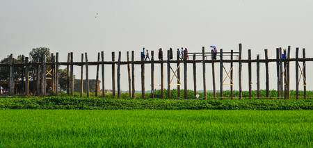Amarapura, Myanmar - Feb 9, 2017. Local people and tourists walking on famous U Bein Bridge in Amarapura, Mandalay Division of Myanmar.のeditorial素材