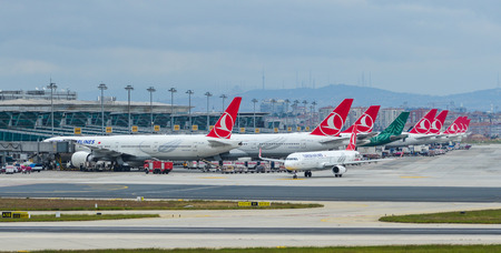 Istanbul, Turkey - Sep 30, 2018. Passenger airplanes taxiing on runway of Istanbul Ataturk Airport (IST).のeditorial素材