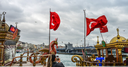 Istanbul, Turkey - Sep 28, 2018. Pleasure yachts at the pier with the flag of Istanbul, Turkey.