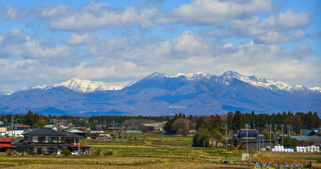 Fukushima, Japan - Apr 15, 2019. Small town with snow mountain in Fukushima, Japan. Fukushima is the place where the nuclear disaster occurred in 2011.のeditorial素材