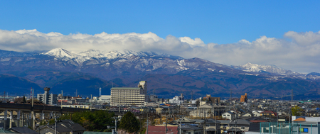 Fukushima, Japan - Apr 15, 2019. Cityscape with snow mountain in Fukushima, Japan. Fukushima is the place where the nuclear disaster occurred in 2011.のeditorial素材