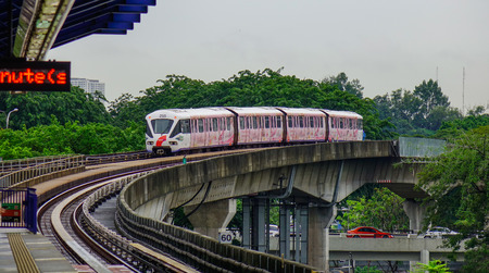 Kuala Lumpur, Malaysia - Nov 14, 2017. Metro train coming to the station in Kuala Lumpur, Malaysia. KL Metro system (LRT) is a great solution for you to get this bustling city.のeditorial素材