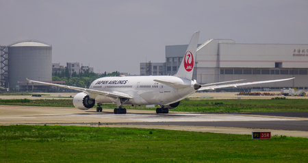 Shanghai, China - Jun 3, 2019. Boeing 787-8 Dreamliner of Japan Airlines (JAL) taxiing on runway of Shanghai Pudong Airport (PVG).のeditorial素材