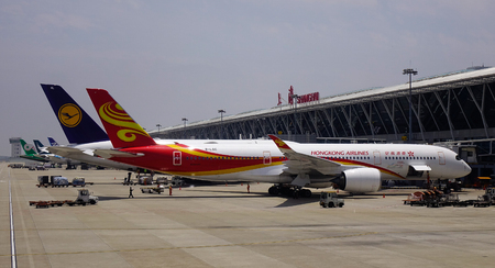 Shanghai, China - Jun 3, 2019. Hong Kong Airlines B-LGC (Airbus A350-900) docking at Shanghai Pudong Airport (PVG).のeditorial素材