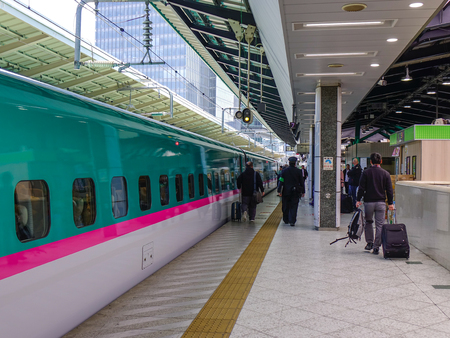 Tokyo, Japan - Apr 13, 2019. Passengers waiting for  train at JR Station in Tokyo, Japan. High speed trains (bullet trains) called  and operated by Japan Railways.のeditorial素材