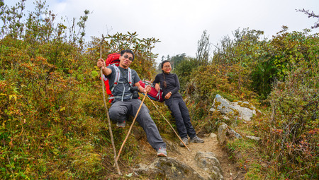 Pokhara, Nepal - Oct 20, 2017. Trekkers walking on the trekking trail of Annapurna Circuit Trek. It is one of most popular treks in Nepal.のeditorial素材