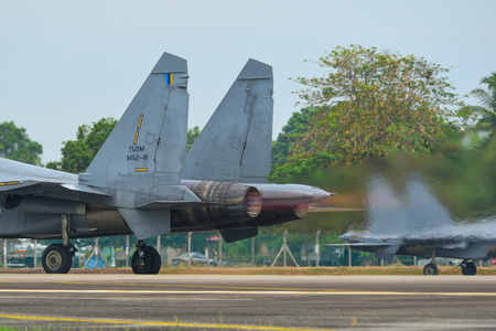 Langkawi, Malaysia - Mar 30, 2019. Royal Malaysian Air Force (TUDM M52-18) Sukhoi SU-30 MKM commencing take-off run at Langkawi Airport (LGK).のeditorial素材