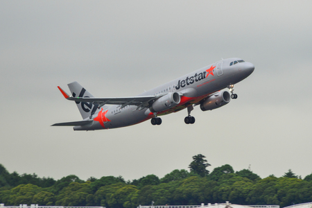 Tokyo, Japan - Jul 4, 2019. Jetstar Japan JA07JJ (Airbus A320) taking-off from Narita Airport (NRT). Narita serves more than 40 million passengers in 2018.のeditorial素材