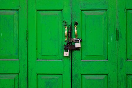 Window with the wooden carved architrave in the old wooden house.の写真素材