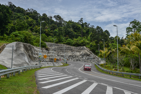 Langkawi, Malaysia - Apr 30, 2018. Rural road in Langkawi, Malaysia. Langkawi is an archipelago made up of 99 islands on Malaysia west coast.のeditorial素材