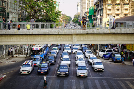 Yangon, Myanmar - Feb 13, 2017. Vehicles stop on Sule Street in Yangon, Myanmar. Yangon is the largest city and the most vibrant in Myanmar and situated in the southern of country.のeditorial素材