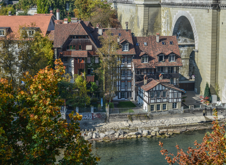 View of the old city center and stone bridge over river Aare in Bern, Switzerland.