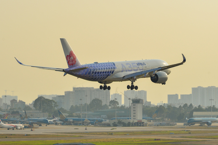 Saigon, Vietnam - Feb 8, 2019. An A350-900 airplane of China Airlines (Carbon Fibre livery) landing at Tan Son Nhat Airport (SGN).のeditorial素材