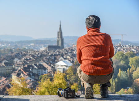 A man looking at the old city from a height of Bern, Switzerland.のeditorial素材