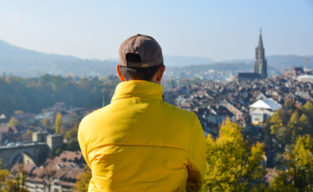 A man looking at the old city from a height of Bern, Switzerland.のeditorial素材