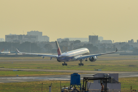 Saigon, Vietnam - Feb 8, 2019. An A350-900 airplane of China Airlines (Carbon Fibre Airbus livery) landing at Tan Son Nhat Airport (SGN).のeditorial素材