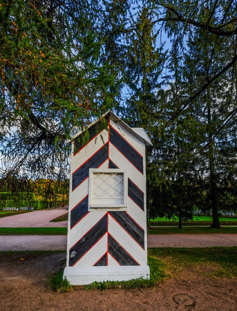 Wooden kiosk for guards in autumn garden of Catherine Palace (Saint Petersburg, Russia).のeditorial素材