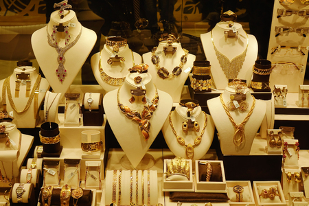 Dubai, UAE - Dec 6, 2018. Gold jewelry in the display window of a jewelleries shop in Dubai Gold Bazaar (Souk).のeditorial素材