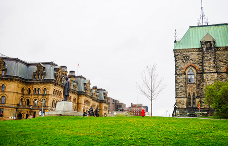 Parliament Buildings in Ottawa, Canada. The historic, neo-Gothic Buildings stand tall on a hill overlooking the majestic Ottawa River.のeditorial素材