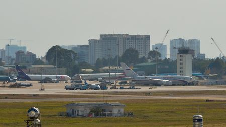 Saigon, Vietnam - Feb 25, 2019. Passenger airplanes taxiing on runway at Tan Son Nhat Airport (SGN) in Saigon (Ho Chi Minh City), Vietnam.のeditorial素材