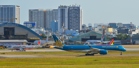 Saigon, Vietnam - Feb 16, 2019. Passenger airplanes taxiing on runway of Tan Son Nhat Airport (SGN) in Saigon (Ho Chi Minh City), Vietnam.のeditorial素材