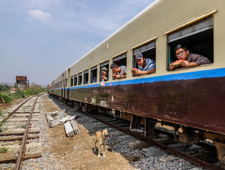 Mandalay, Myanmar - Feb 23, 2016. Passengers on the train at rural railway station in Mandalay, Myanmar. Rail transport in Myanmar consists of a 11,025 km railway network.のeditorial素材