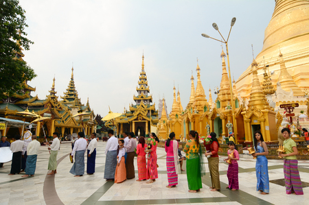 Yangon, Myanmar - Feb 26, 2016. People praying at Shwedagon Pagoda in Yangon, Myanmar. Shwedagon is the most famous pagoda in the world and a must see place in Yangon.のeditorial素材