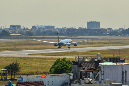 Saigon, Vietnam - Feb 19, 2019. An A350-900 airplane of Vietnam Airlines landing at Tan Son Nhat Airport (SGN).のeditorial素材