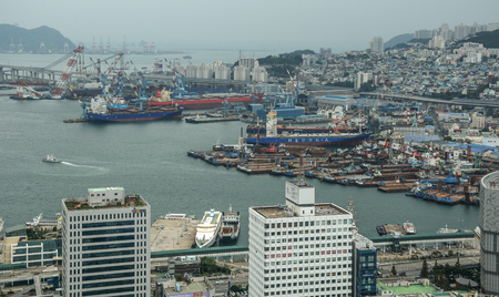 Busan, South Korea - Sep 18, 2016. View of downtown on coast in Busan, S. Korea. Beautiful scenery from Busan Tower in rainy day.のeditorial素材
