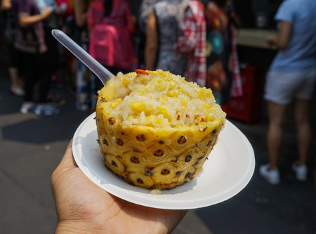 Sweet rice with yellow pineapple at old town in Chengdu, China.のeditorial素材