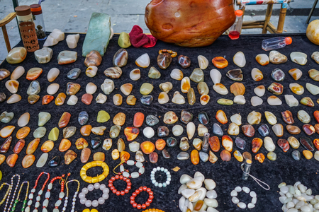 chengdu, China - Aug 20, 2016. Selling precious stones at street market in Chengdu, China. Chengdu is the capital of southwestern China Sichuan province.のeditorial素材