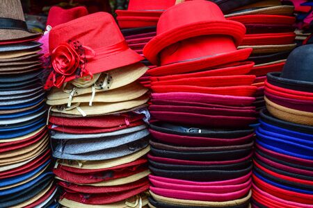Selling colorful hats at street market in Fenghuang Ancient Town, China.の写真素材