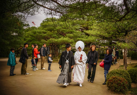 Kyoto, Japan - Apr 6, 2014. Unidentified Japanese bride and groom with traditional costume celebrate a Shinto wedding at Heian Jingu Shrine in Kyoto, Japan.のeditorial素材