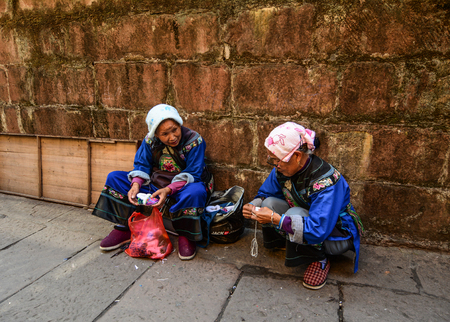 Hunan, China - Nov 6, 2015. Selling souvenirs at Fenghuang Old Town in Hunan, China. The ancient town was added to the UNESCO World Heritage in 2008.のeditorial素材