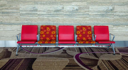 Waiting chair at departure terminal of international airport.
