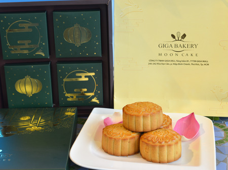 Saigon, Vietnam - Aug 6, 2019. Tasty moon cake with the box for sale at the supermarket in Saigon (Ho Chi Minh City), Vietnam.のeditorial素材