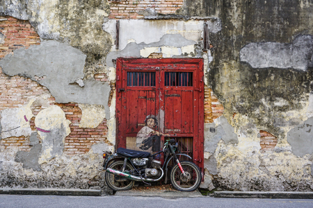 Georgetown, Malaysia - Aug 21, 2014. Penang Street Art, Georgetown Attractions. Beautiful wall painting of children all across historical Georgetown by Ernest Zacharevic.のeditorial素材