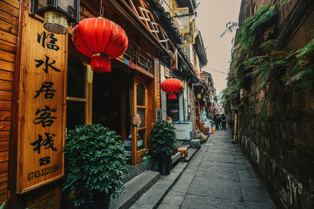 Hunan, China - Nov 6, 2015. Street of Fenghuang Old Town in Hunan, China. The ancient town was added to the UNESCO World Heritage in 2008.のeditorial素材
