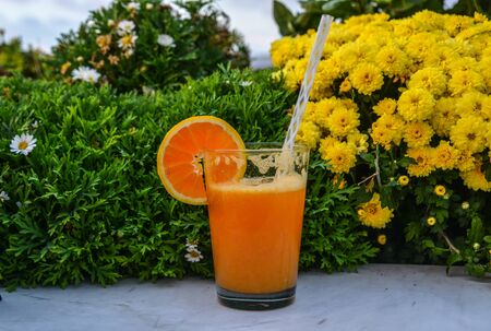 Orange juice on glass cup at a coffee shop in Athens, Greece.の写真素材