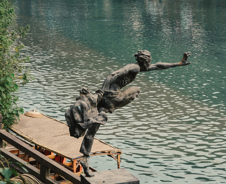 Hunan, China - Nov 6, 2015. Bronze statue at Fenghuang Old Town in Hunan, China. The ancient town was added to the UNESCO World Heritage in 2008.のeditorial素材