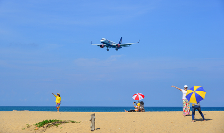 Phuket, Thailand - Apr 5, 2019. Azur Air Boeing 757 landing above the sand beach near Phuket Airport (HKT).のeditorial素材