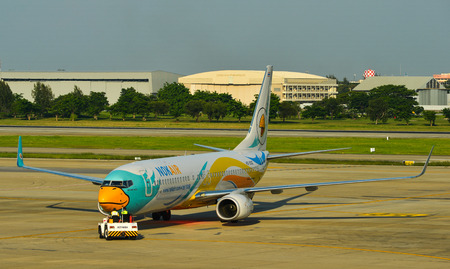 Bangkok, Thailand - Apr 24, 2018. HS-DBZ Nok Air Boeing 737-800 taxiing on runway of Bangkok Don...