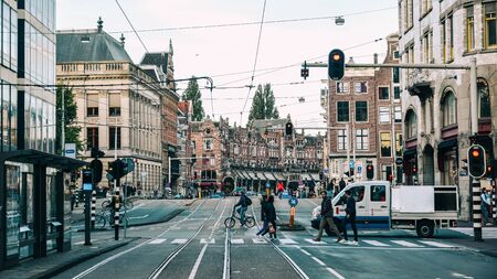 Amsterdam, Holland - Oct 7, 2018. Cityscape of Amsterdam with famous architectural landmarks and busy traffic on roads.の写真素材
