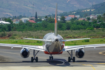Dalat, Vietnam - Apr 20, 2018. VN-A560 Jetstar Pacific Airbus A320 airplane docking at Lien Khuong Airport (DLI) in Dalat, Vietnam.のeditorial素材