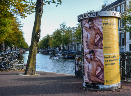 Amsterdam, Holland - Oct 7, 2018. LGBT billboard on street in Amsterdam, Holland. Amsterdam is one of the most attractive cities to visit and to live in.のeditorial素材