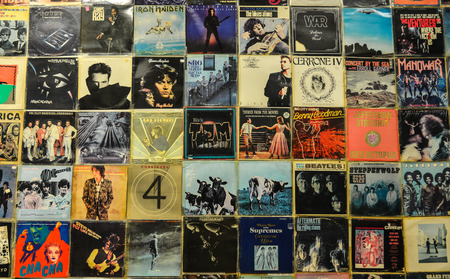 Athens, Greece - Oct 12, 2018. Old faded vinyl records pop and rock music vintage album sleeves...